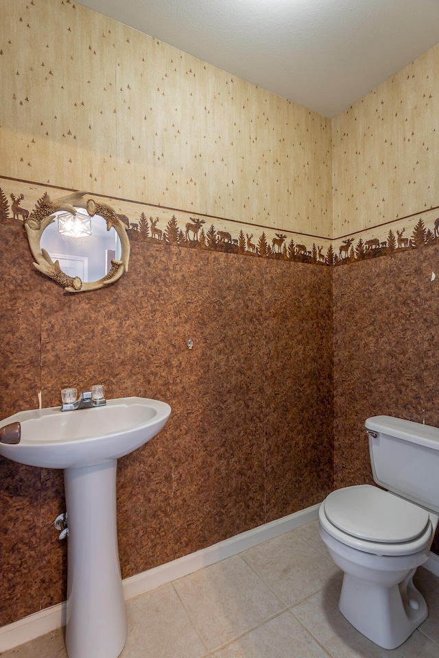 bathroom featuring tile patterned flooring and toilet