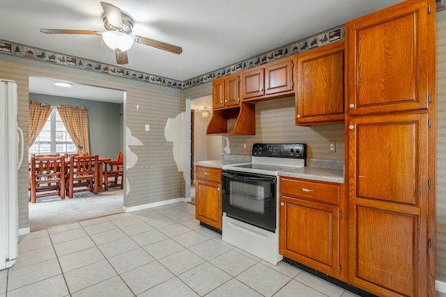 kitchen featuring white appliances, light tile patterned floors, and ceiling fan