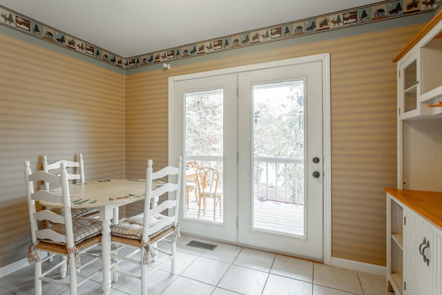 tiled dining room with french doors