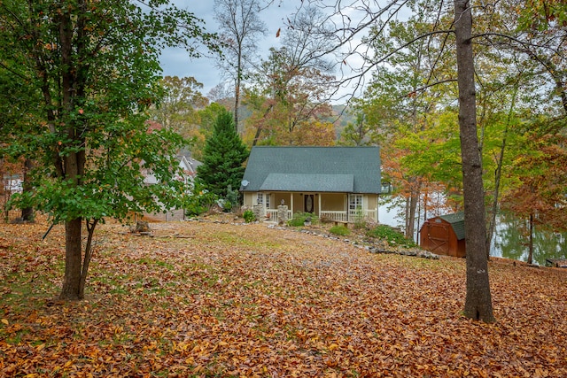 view of front of property with a shed and covered porch