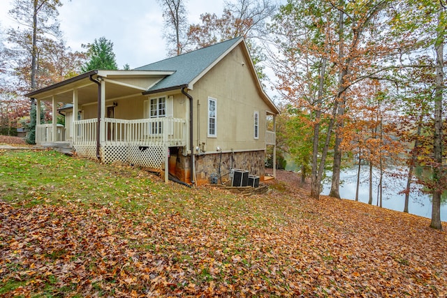 view of property exterior with covered porch