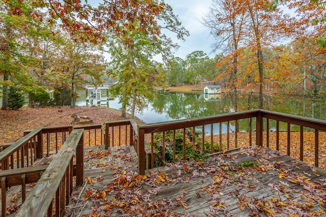 wooden terrace featuring a water view