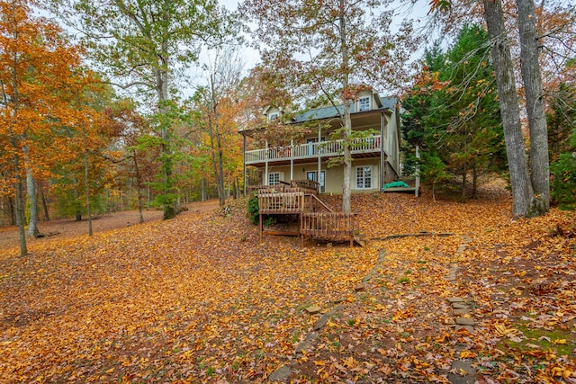 back of house featuring a wooden deck