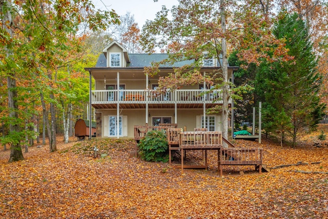 rear view of house with a wooden deck