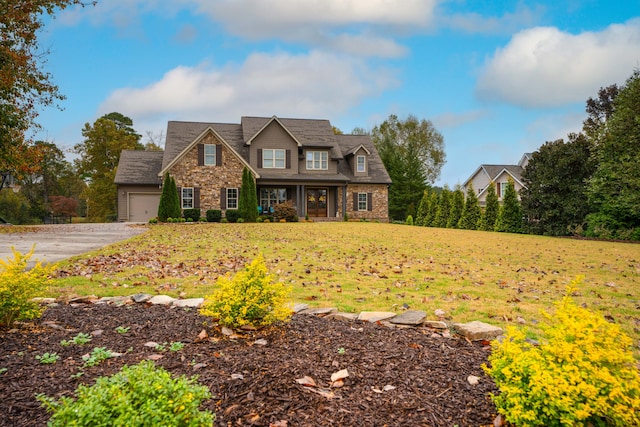 view of front of house with a front lawn and a garage