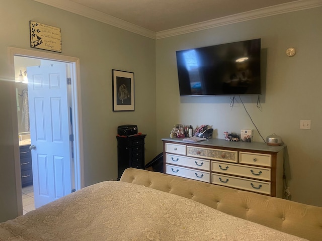 bedroom featuring ensuite bathroom and ornamental molding