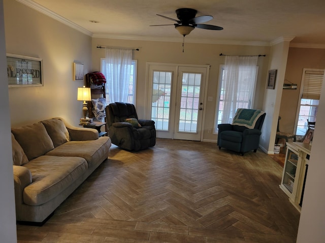 living room with dark parquet floors, ceiling fan, and crown molding