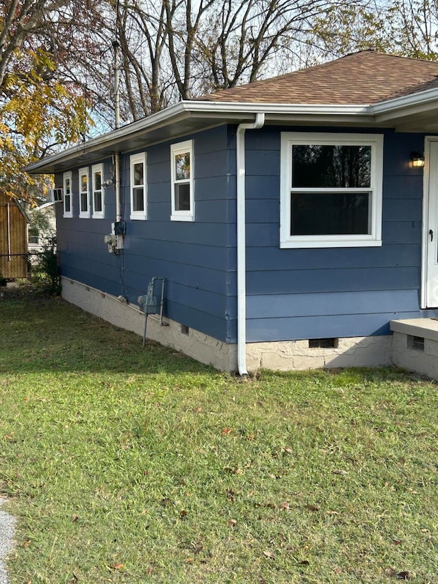 view of property exterior with a yard