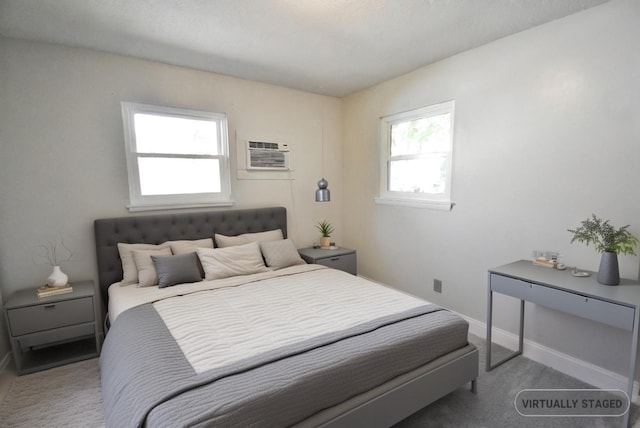 carpeted bedroom with a wall unit AC