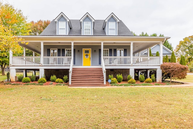 view of front of house featuring covered porch and a front lawn