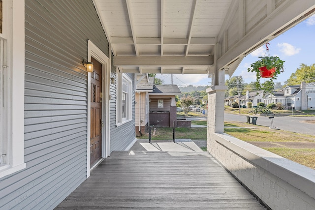 wooden terrace featuring a porch