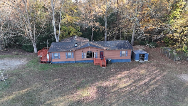 134 Old Spring Rd, Rising Fawn, GA 30738 - view of front of home featuring a storage shed, an outdoor structure, and a view of trees