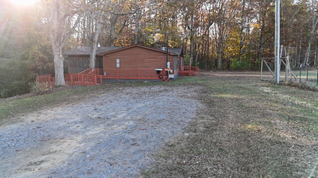 view of yard featuring a wooden deck