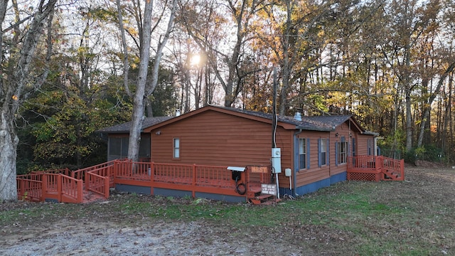 view of home's exterior with a deck