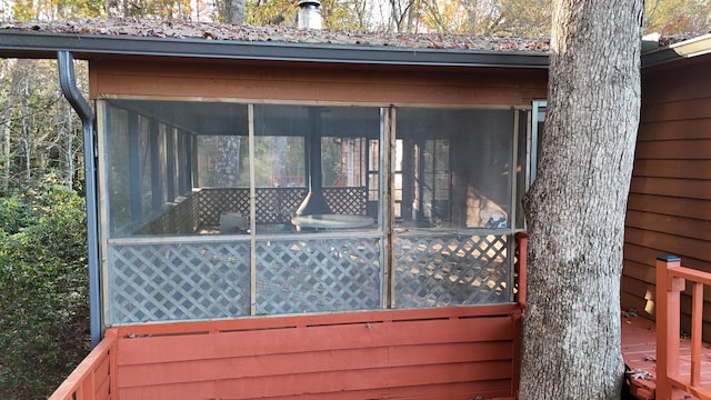 deck with a sunroom