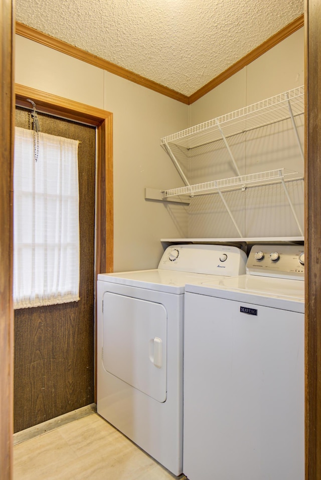 134 Old Spring Rd, Rising Fawn, GA 30738 - laundry room featuring ornamental molding, washing machine and dryer, and a textured ceiling