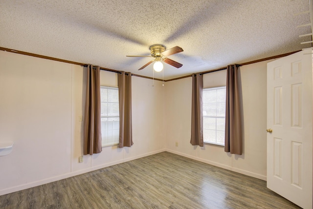 134 Old Spring Rd, Rising Fawn, GA 30738 - empty room with ceiling fan, wood finished floors, a textured ceiling, crown molding, and baseboards