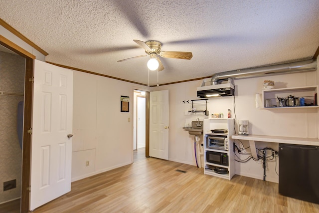 134 Old Spring Rd, Rising Fawn, GA 30738 - kitchen featuring light wood finished floors, a ceiling fan, open shelves, a textured ceiling, and crown molding