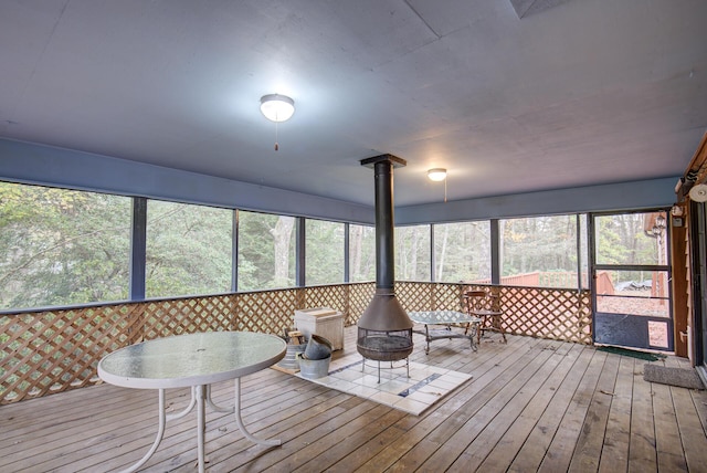 134 Old Spring Rd, Rising Fawn, GA 30738 - sunroom with a wood stove, healthy amount of natural light, and outdoor dining area