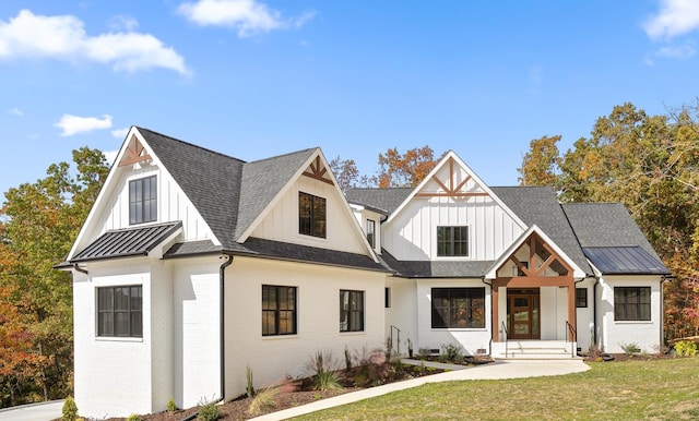 modern inspired farmhouse with a front yard