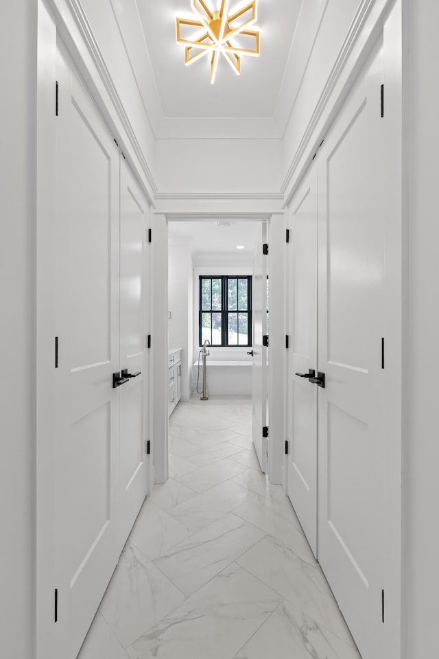 hallway with crown molding and french doors