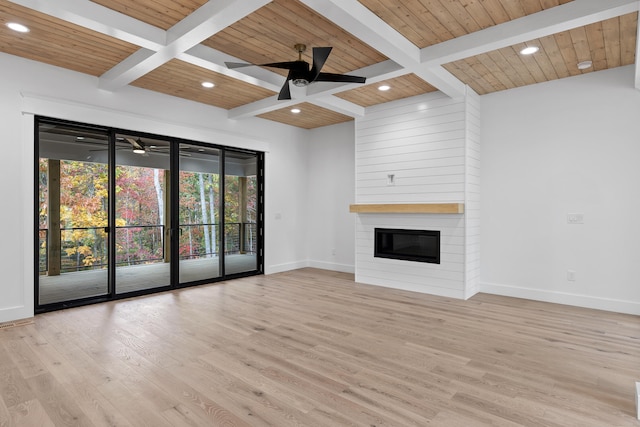 unfurnished living room with wood ceiling, beamed ceiling, light wood-type flooring, a fireplace, and ceiling fan