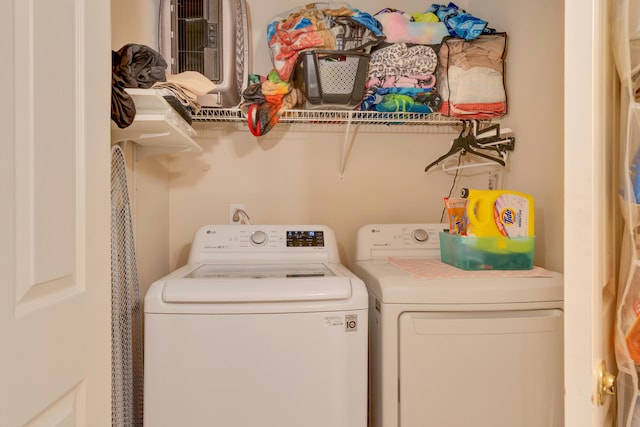 washroom with washing machine and clothes dryer