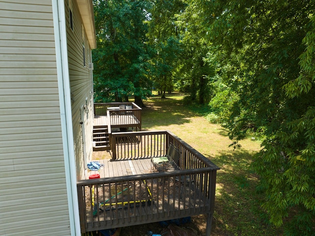 wooden deck with a yard