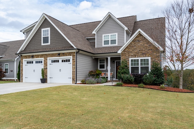 craftsman inspired home with stone siding, a front lawn, concrete driveway, and a shingled roof