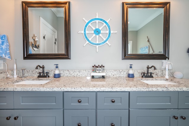 bathroom with double vanity, a sink, and crown molding