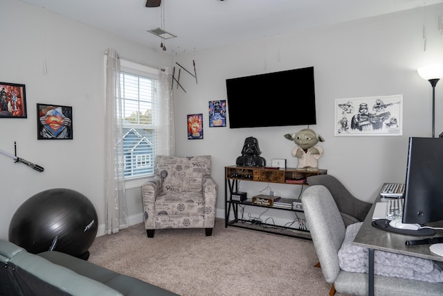 carpeted home office featuring visible vents and baseboards