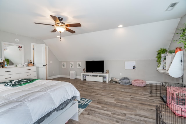 bedroom with lofted ceiling, visible vents, ceiling fan, and light wood finished floors