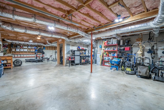 unfinished basement featuring electric panel and a workshop area