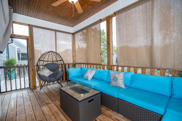 unfurnished sunroom with ceiling fan and wood ceiling