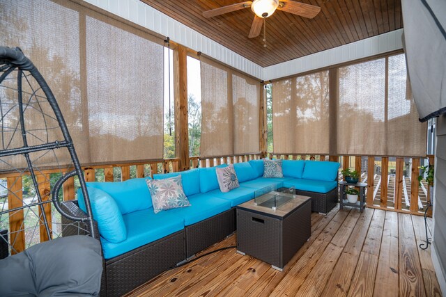 sunroom / solarium featuring wood ceiling and ceiling fan