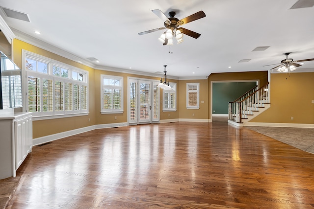 unfurnished living room with dark wood-type flooring, ceiling fan, and ornamental molding