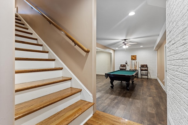 game room featuring dark hardwood / wood-style flooring, ceiling fan, billiards, and brick wall