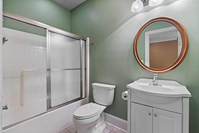 full bathroom featuring tile patterned flooring, vanity, combined bath / shower with glass door, and toilet