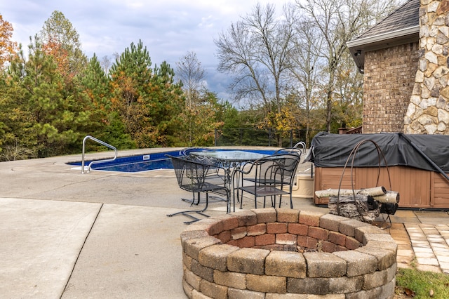 view of patio / terrace featuring a fire pit