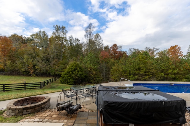 view of patio featuring an outdoor fire pit