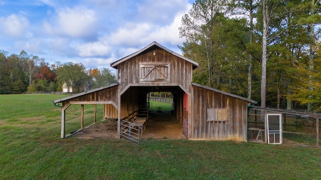 view of outbuilding featuring a yard