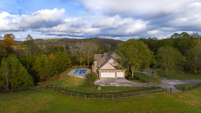 birds eye view of property with a rural view