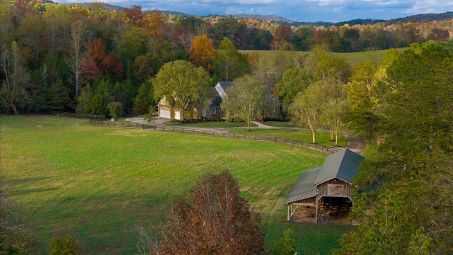 birds eye view of property with a rural view