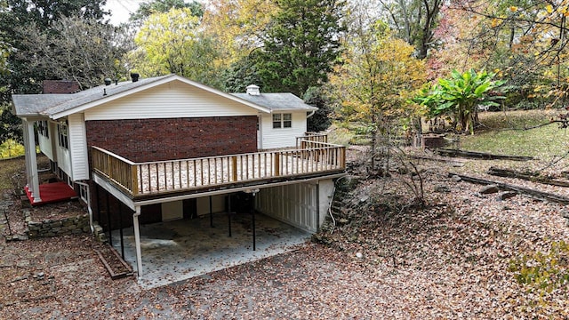 back of property featuring a wooden deck