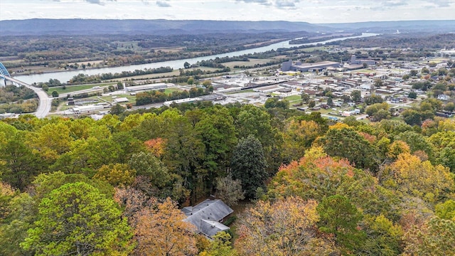 birds eye view of property with a water and mountain view