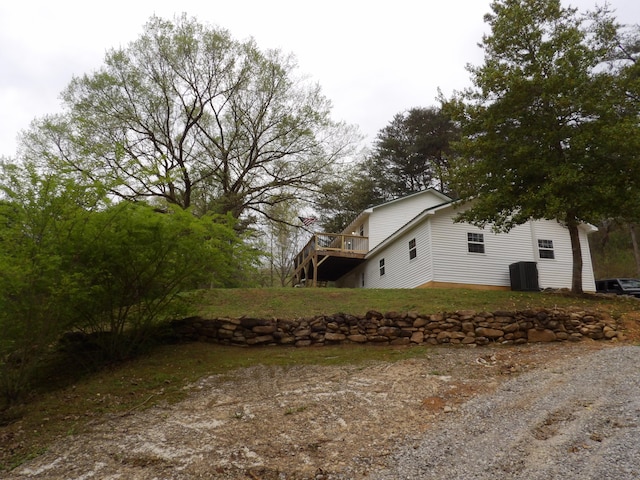 view of side of home with a deck