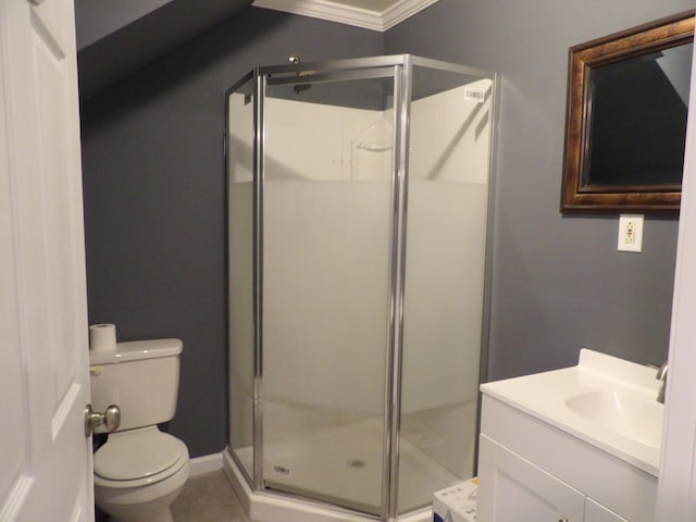 bathroom with crown molding, toilet, tile patterned flooring, and a shower with shower door