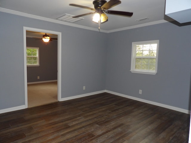 unfurnished room with ceiling fan, crown molding, and dark wood-type flooring