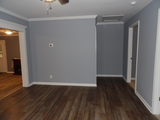 unfurnished room featuring ceiling fan, crown molding, and dark hardwood / wood-style flooring