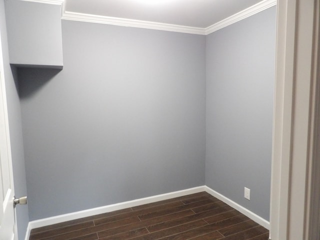 unfurnished room with ornamental molding and dark hardwood / wood-style flooring